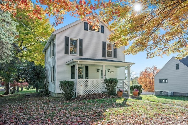 view of property with central AC unit and a porch