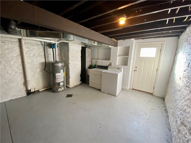 basement with gas water heater and washing machine and clothes dryer