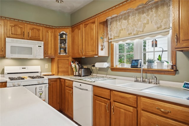 kitchen with sink and white appliances