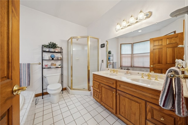 bathroom featuring vanity, a shower with shower door, toilet, and tile patterned floors