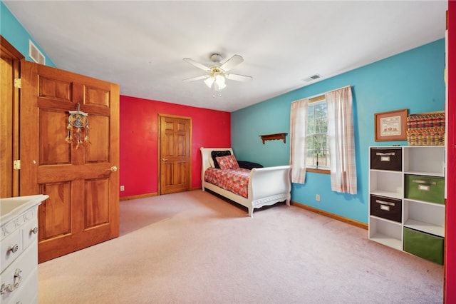 bedroom featuring light colored carpet and ceiling fan