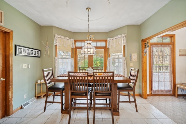 dining room with light colored carpet