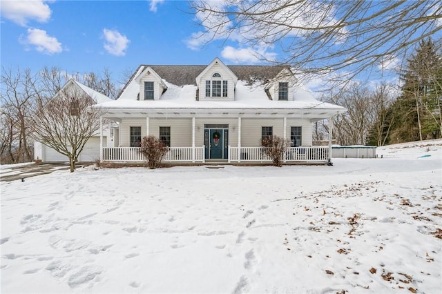 new england style home with covered porch