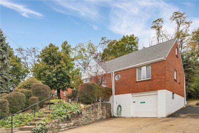 view of side of property featuring a garage