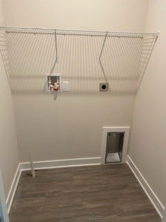 clothes washing area featuring hookup for an electric dryer and dark hardwood / wood-style floors