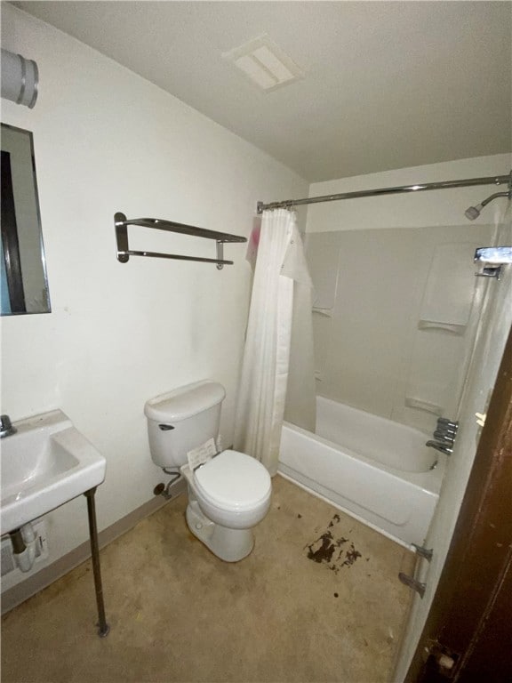 bathroom with shower / bath combo and toilet