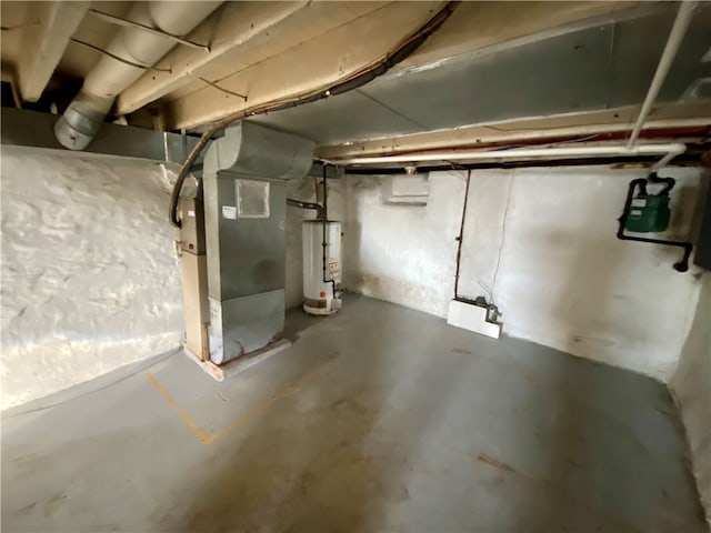 basement with water heater and heating unit