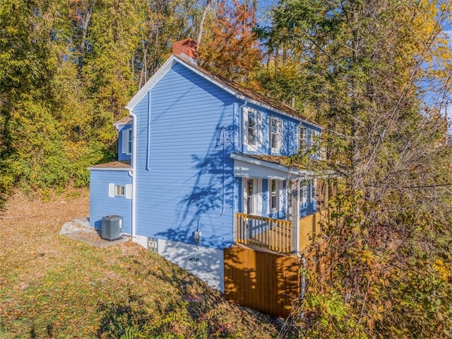 exterior space with a balcony and central AC