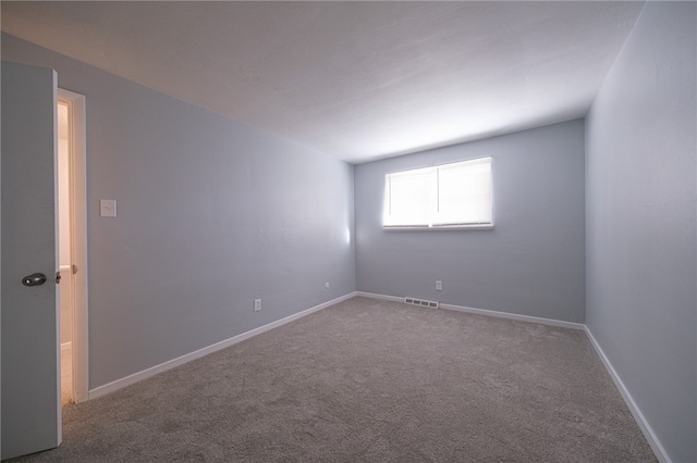 unfurnished room with carpet