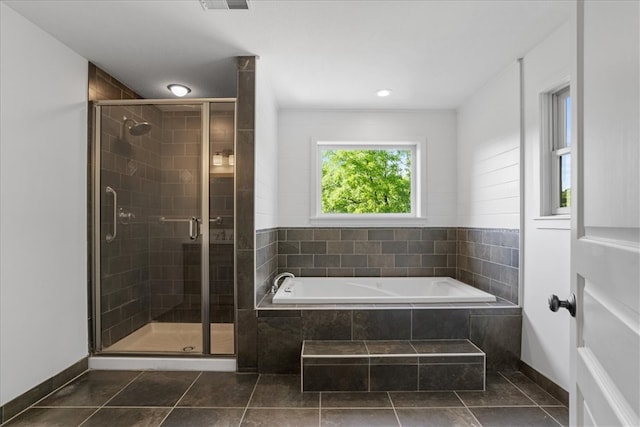 bathroom featuring independent shower and bath and tile patterned flooring