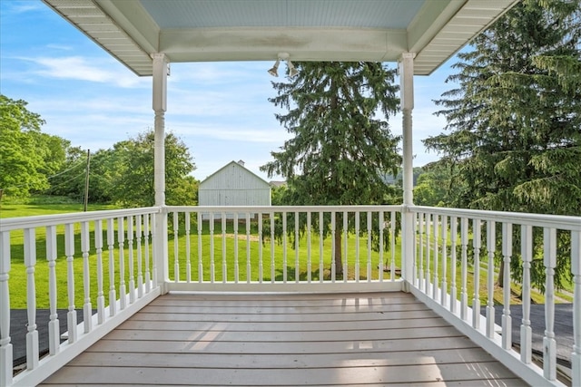 wooden deck featuring a yard