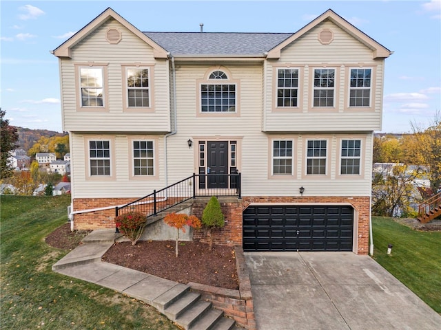1315 Lucia Dr, Canonsburg, PA 15317 - view of front facade featuring concrete driveway, a garage, a front yard, and stairs