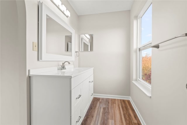 bathroom with vanity and hardwood / wood-style floors