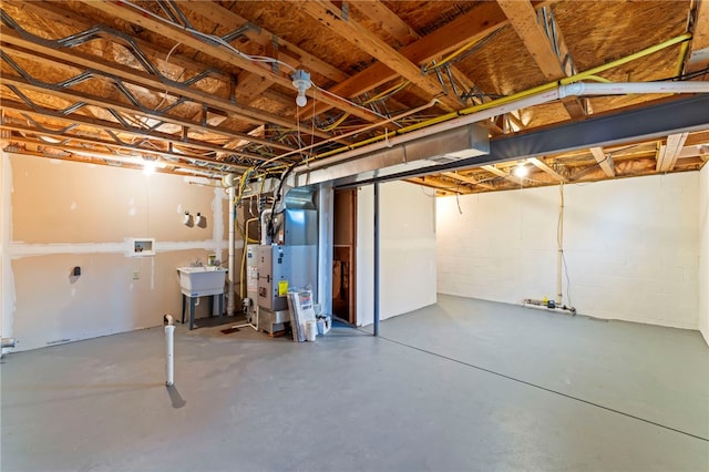 basement featuring sink and heating unit