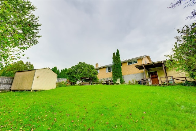 view of yard with a storage shed