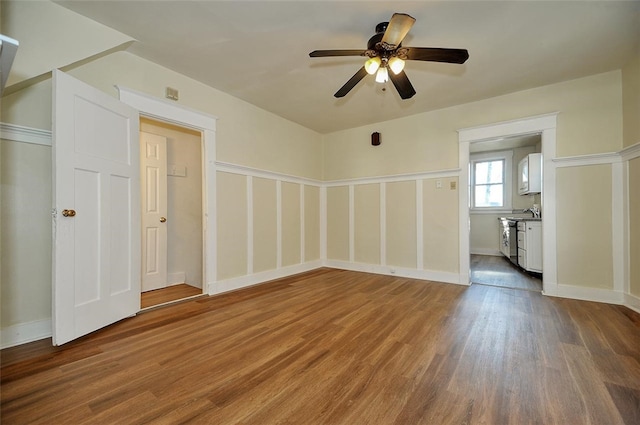 spare room featuring ceiling fan and wood-type flooring