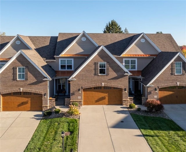 craftsman-style home with a garage and a front yard