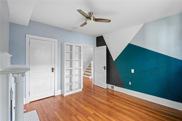 interior space with ceiling fan and light hardwood / wood-style flooring