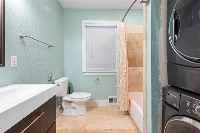 full bathroom featuring shower / bath combination with curtain, toilet, tile patterned floors, vanity, and stacked washer / drying machine