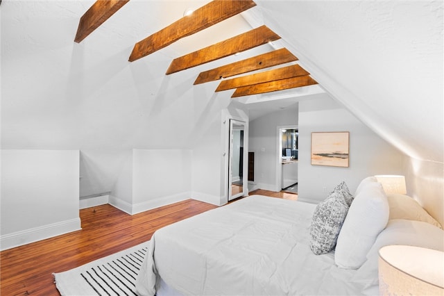 bedroom with lofted ceiling with beams and wood-type flooring