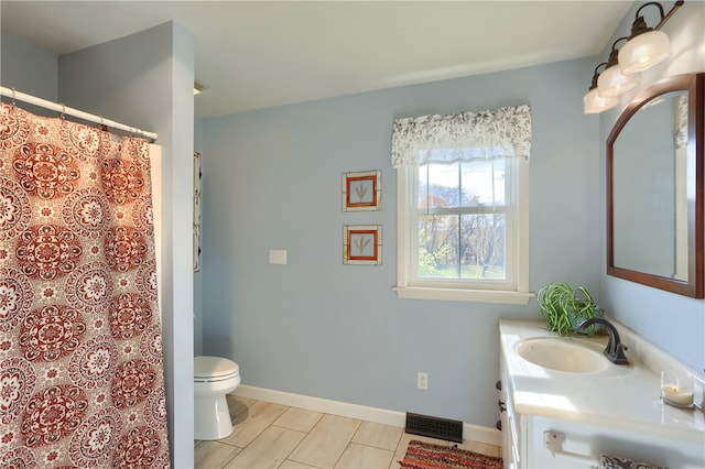 bathroom with vanity and toilet