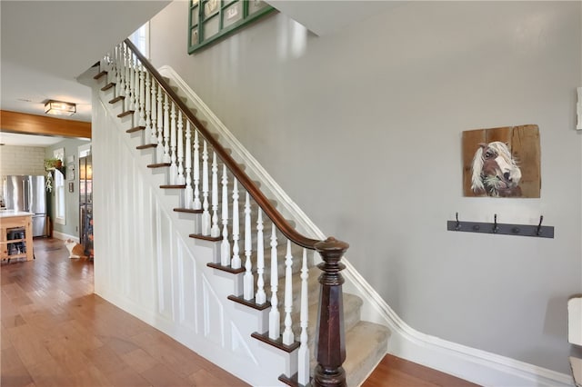 stairway featuring hardwood / wood-style flooring