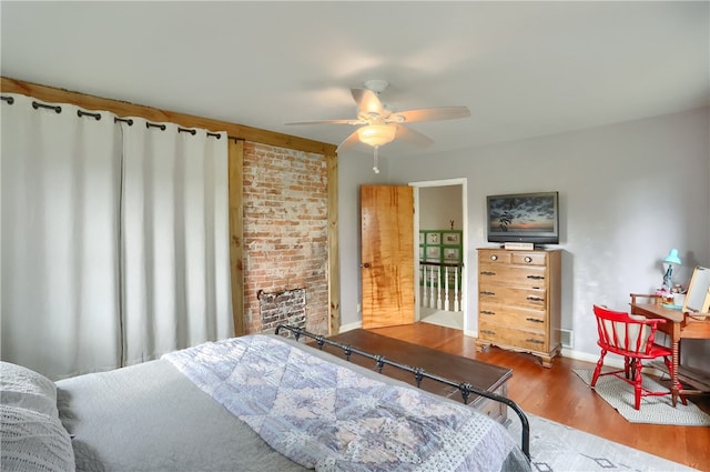 bedroom with hardwood / wood-style floors and ceiling fan