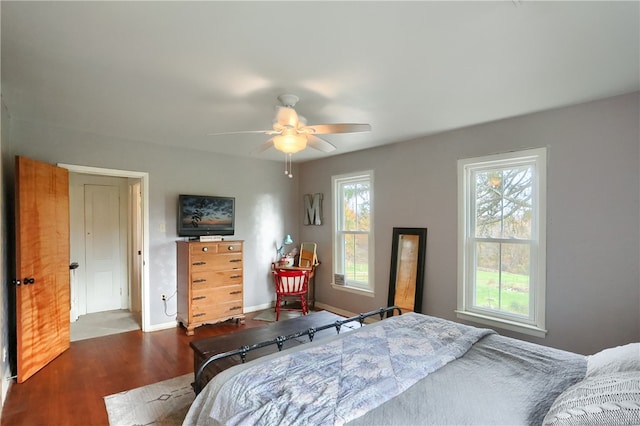 bedroom featuring dark hardwood / wood-style flooring and ceiling fan