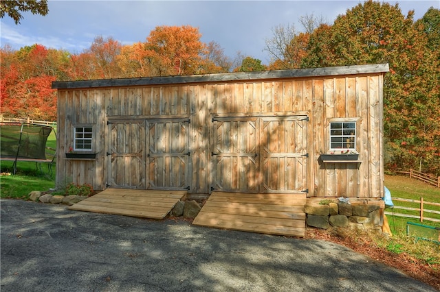 view of outbuilding featuring a trampoline