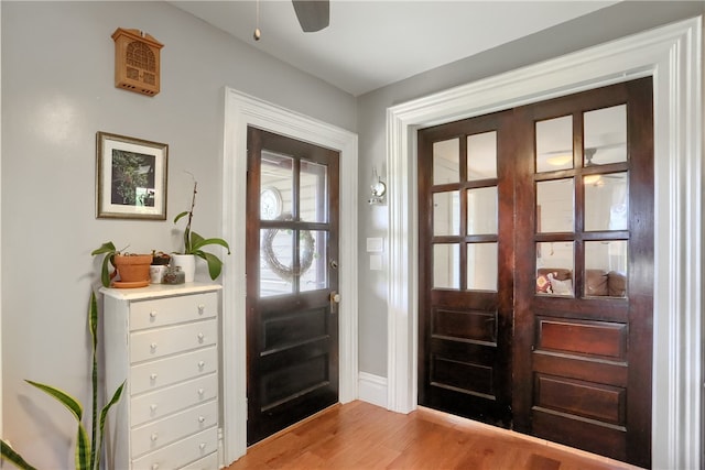 entryway with light hardwood / wood-style floors and ceiling fan