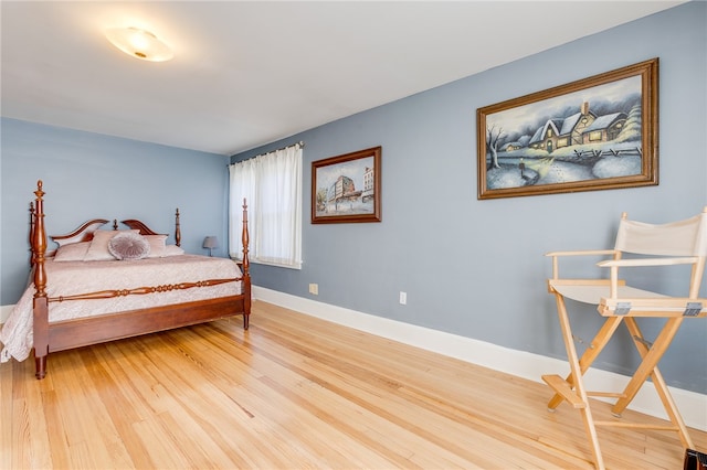 bedroom with hardwood / wood-style floors