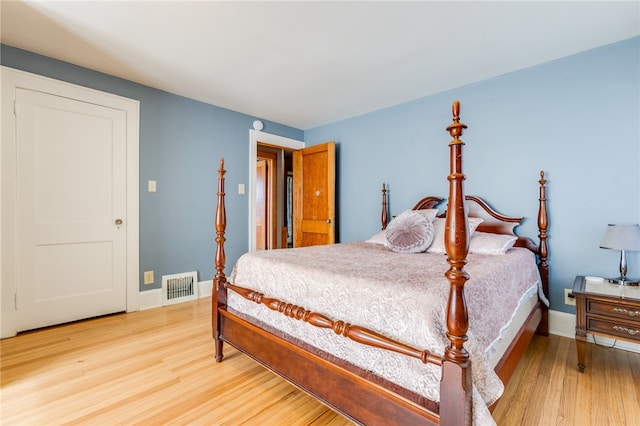 bedroom with wood-type flooring