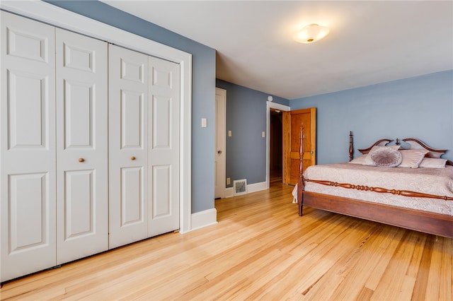 bedroom with a closet and light wood-type flooring