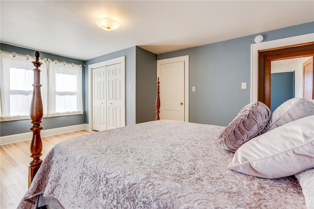 bedroom featuring a closet and light wood-type flooring