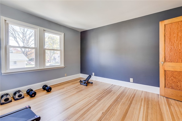 workout area featuring hardwood / wood-style floors