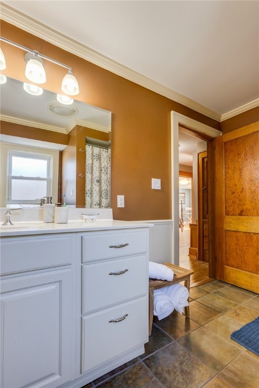 bathroom featuring vanity and ornamental molding