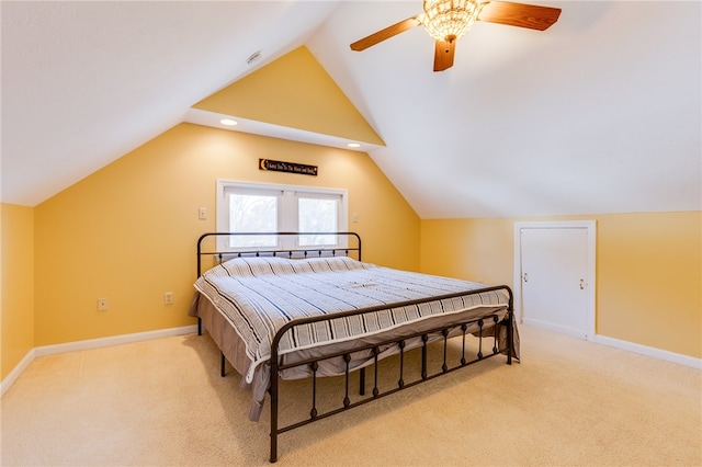 carpeted bedroom with lofted ceiling and ceiling fan