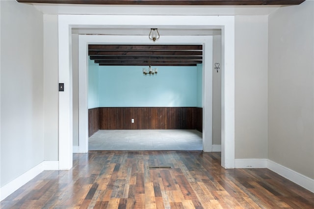 empty room with dark hardwood / wood-style floors