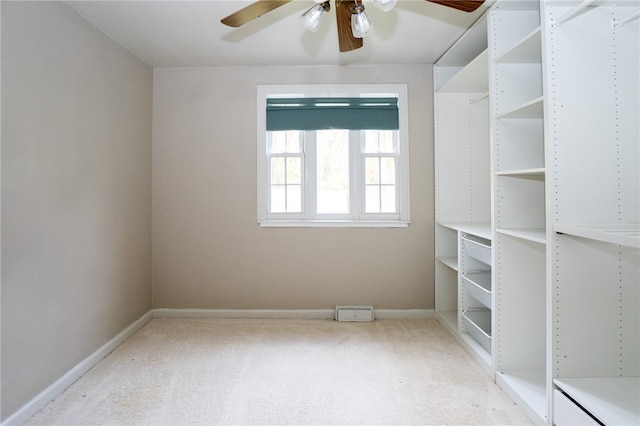 carpeted empty room with ceiling fan