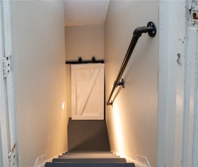 staircase with a barn door