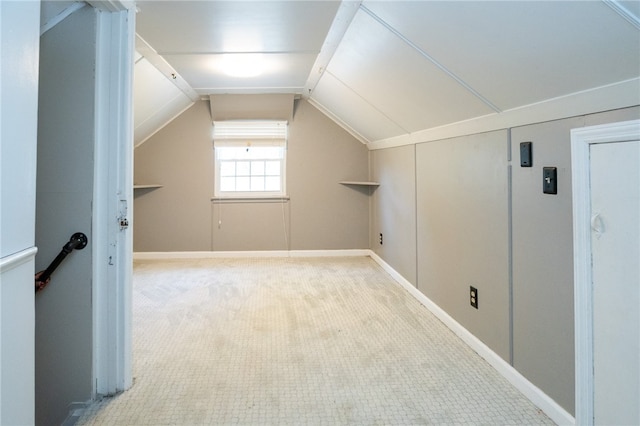 bonus room featuring carpet and vaulted ceiling