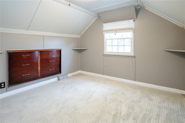 additional living space with light carpet and lofted ceiling