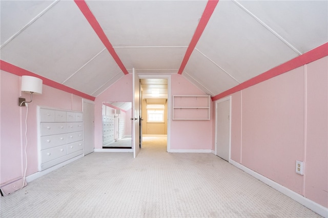 bonus room featuring carpet flooring and vaulted ceiling