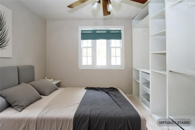 bedroom featuring ceiling fan and light hardwood / wood-style flooring