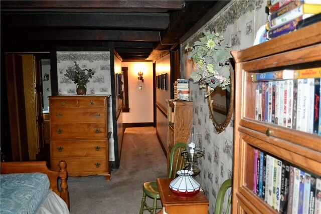 hall with beam ceiling and carpet floors