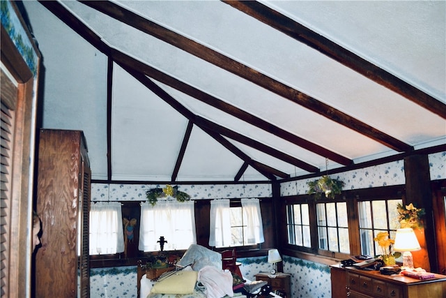 living room with vaulted ceiling with beams