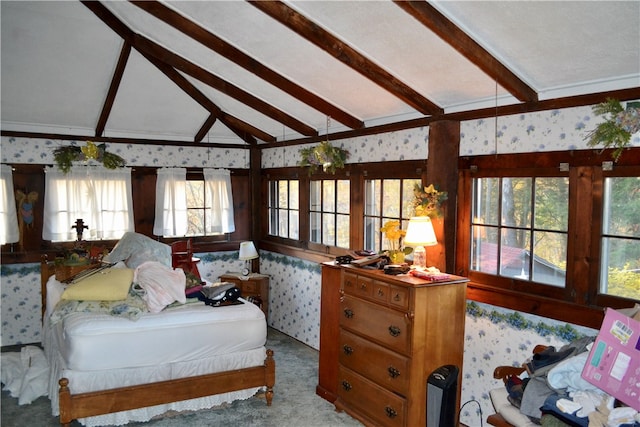 carpeted bedroom with vaulted ceiling with beams