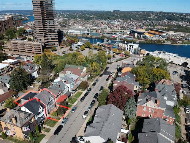 birds eye view of property featuring a water view