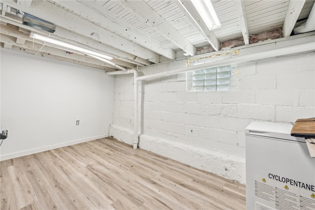 basement featuring light hardwood / wood-style floors