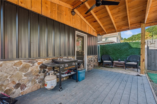 view of patio with a deck and ceiling fan